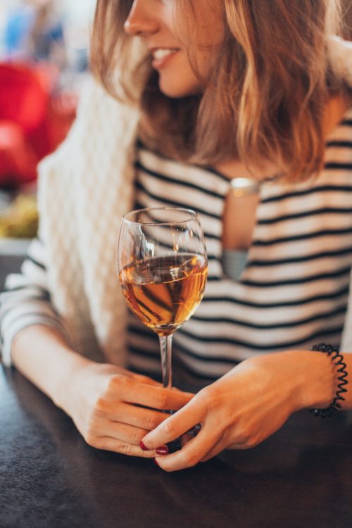 woman-holding-glass-of-wine-1927313